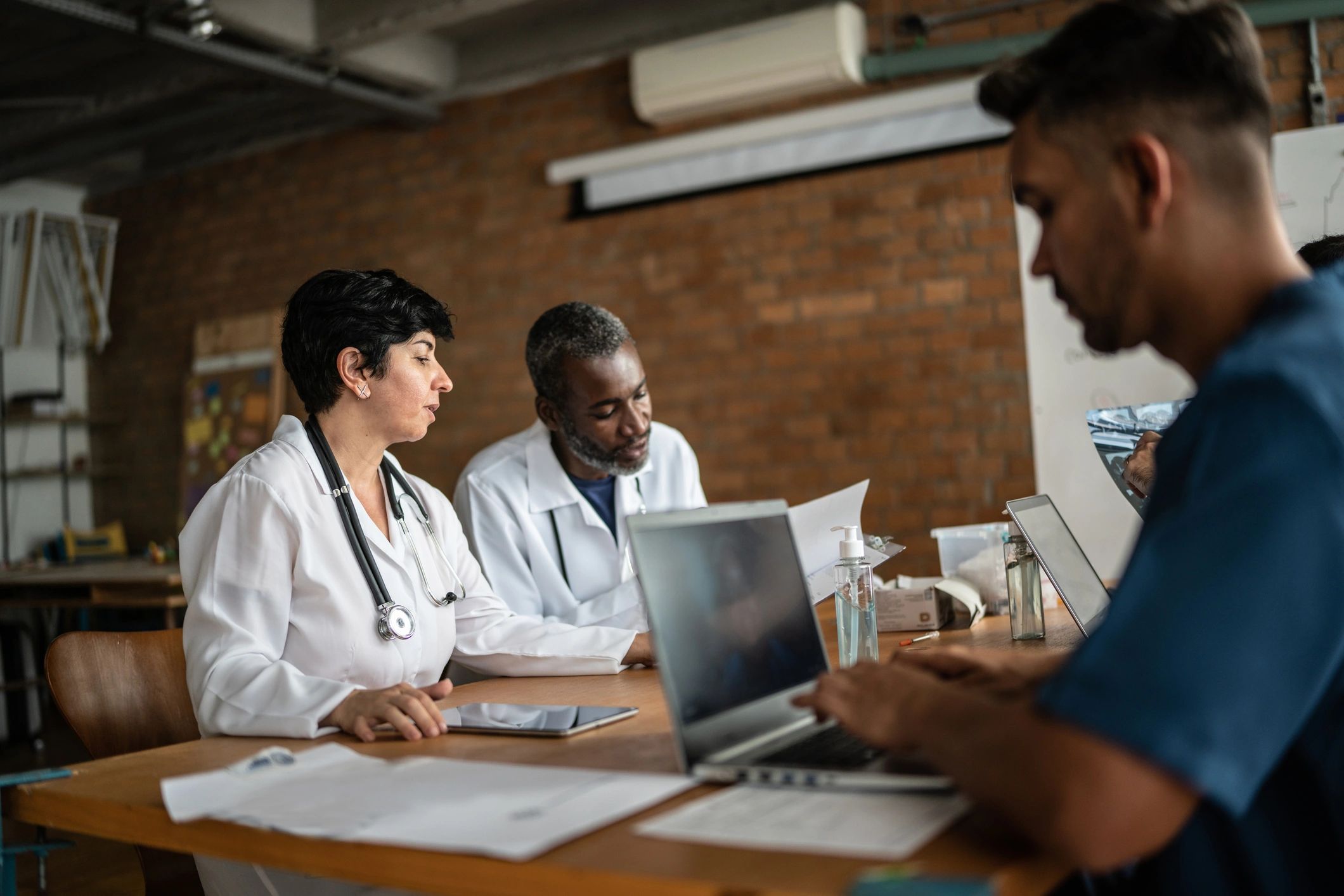 Doctors collaborating during a clinic meeting