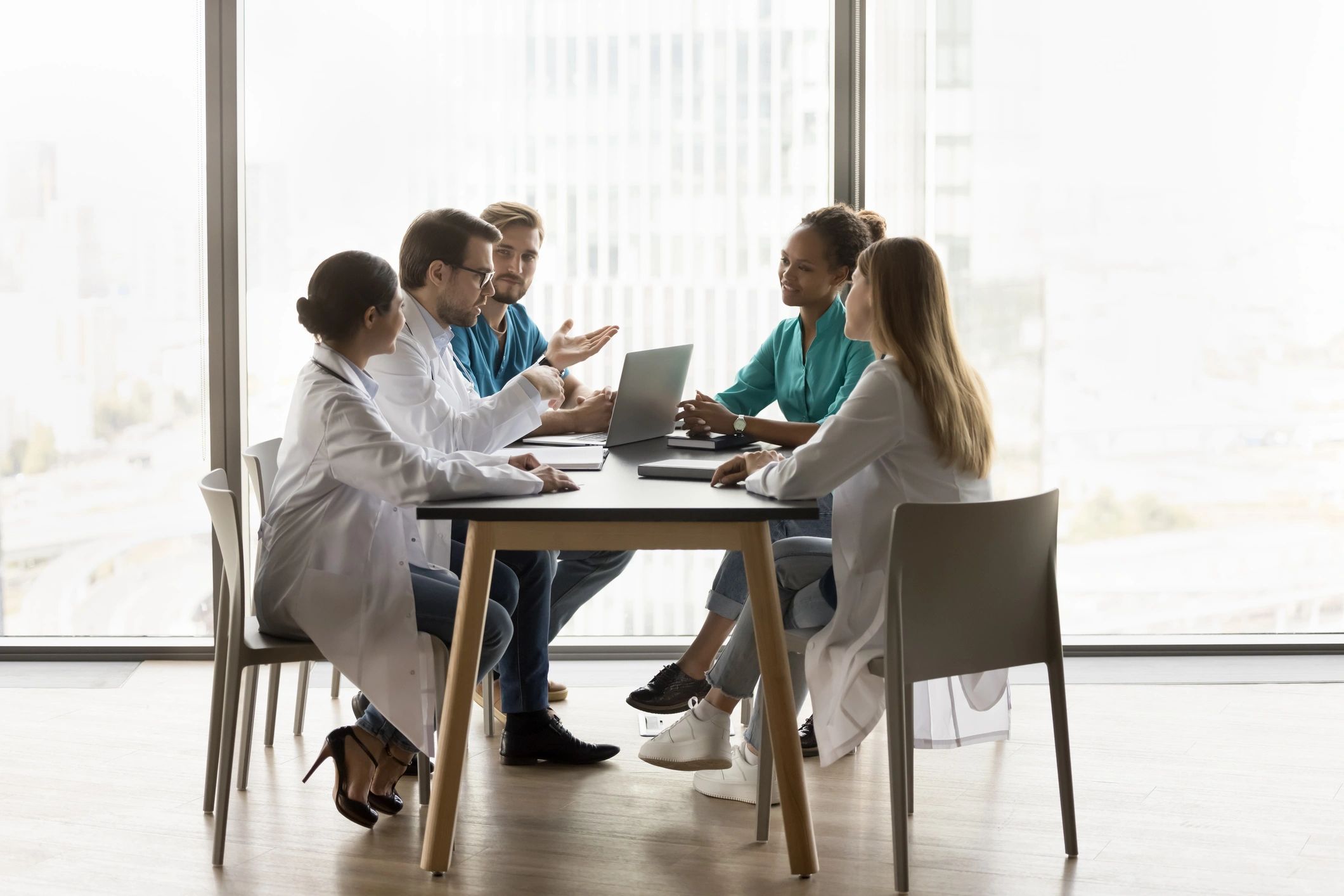 Hospital clinicians collaborating around a table