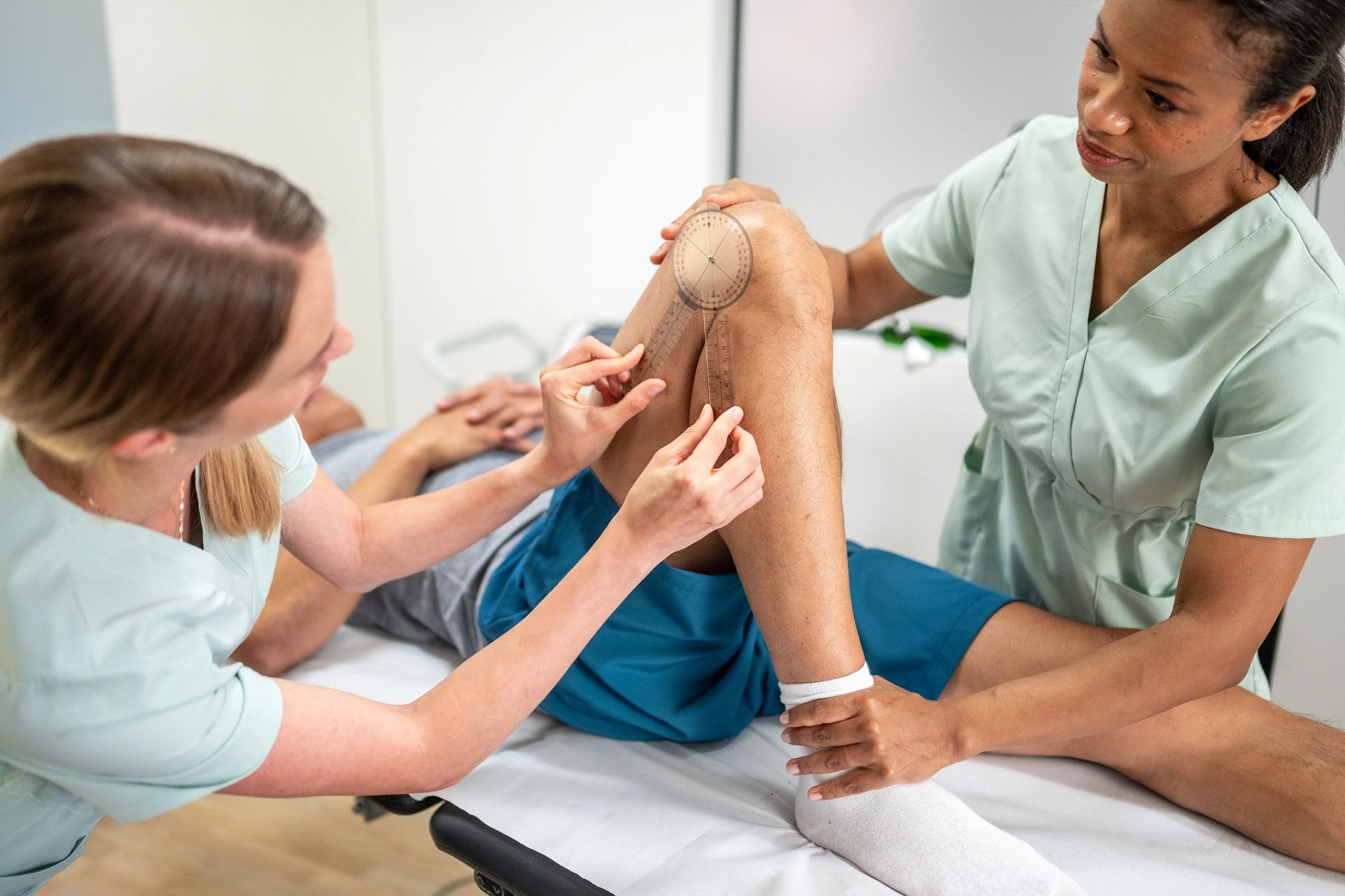 Healthcare professional evaluating a rehabilitation patient